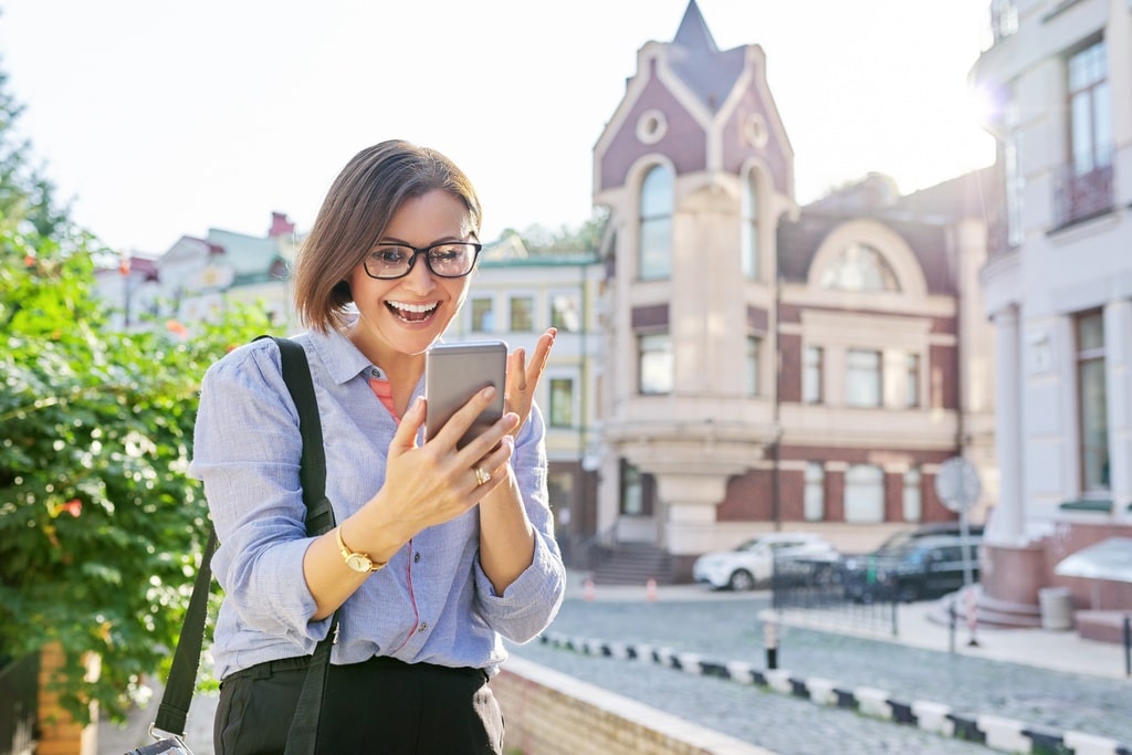 Woman using smartphone outdoors