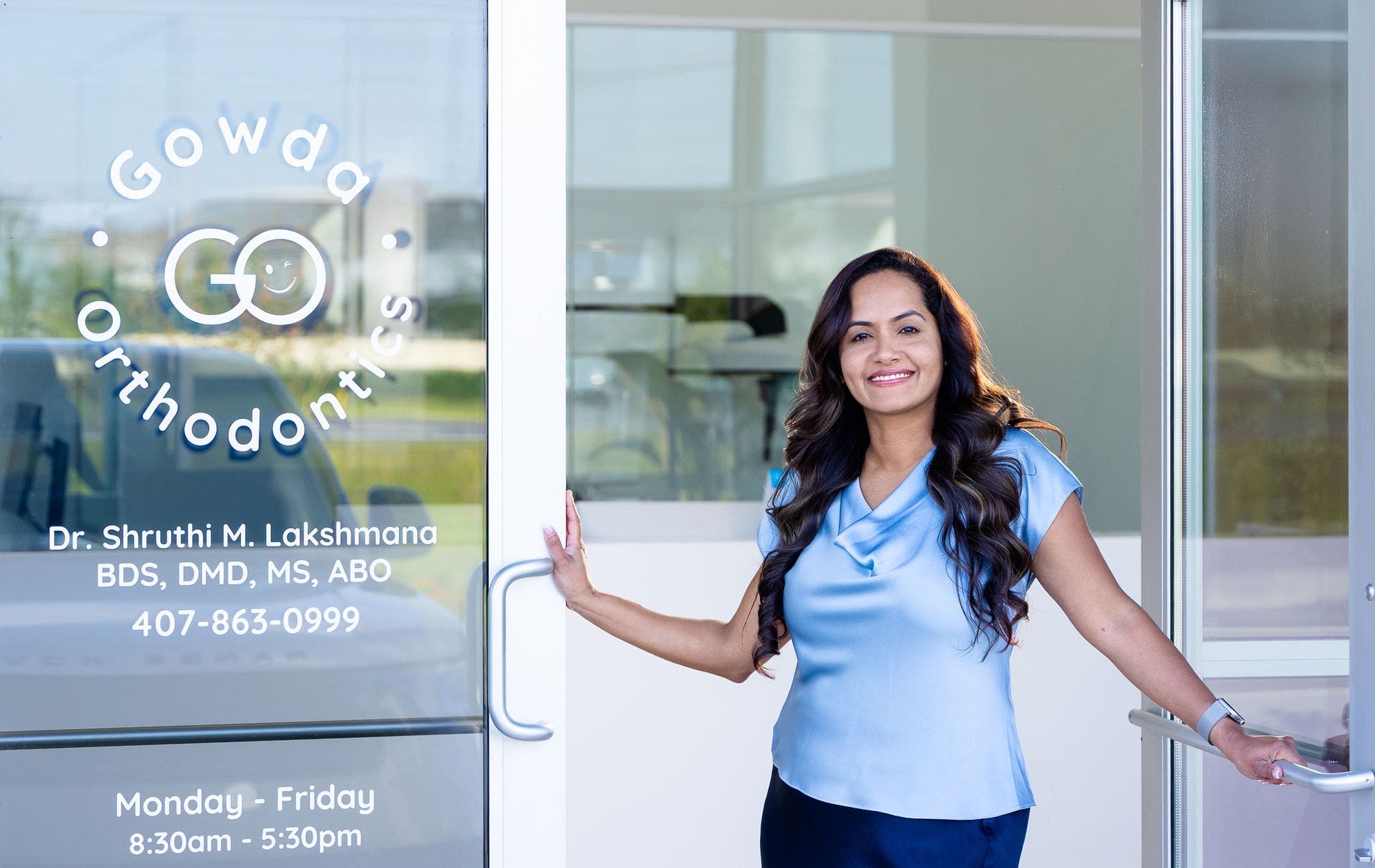 Woman standing in dental clinic lobby
